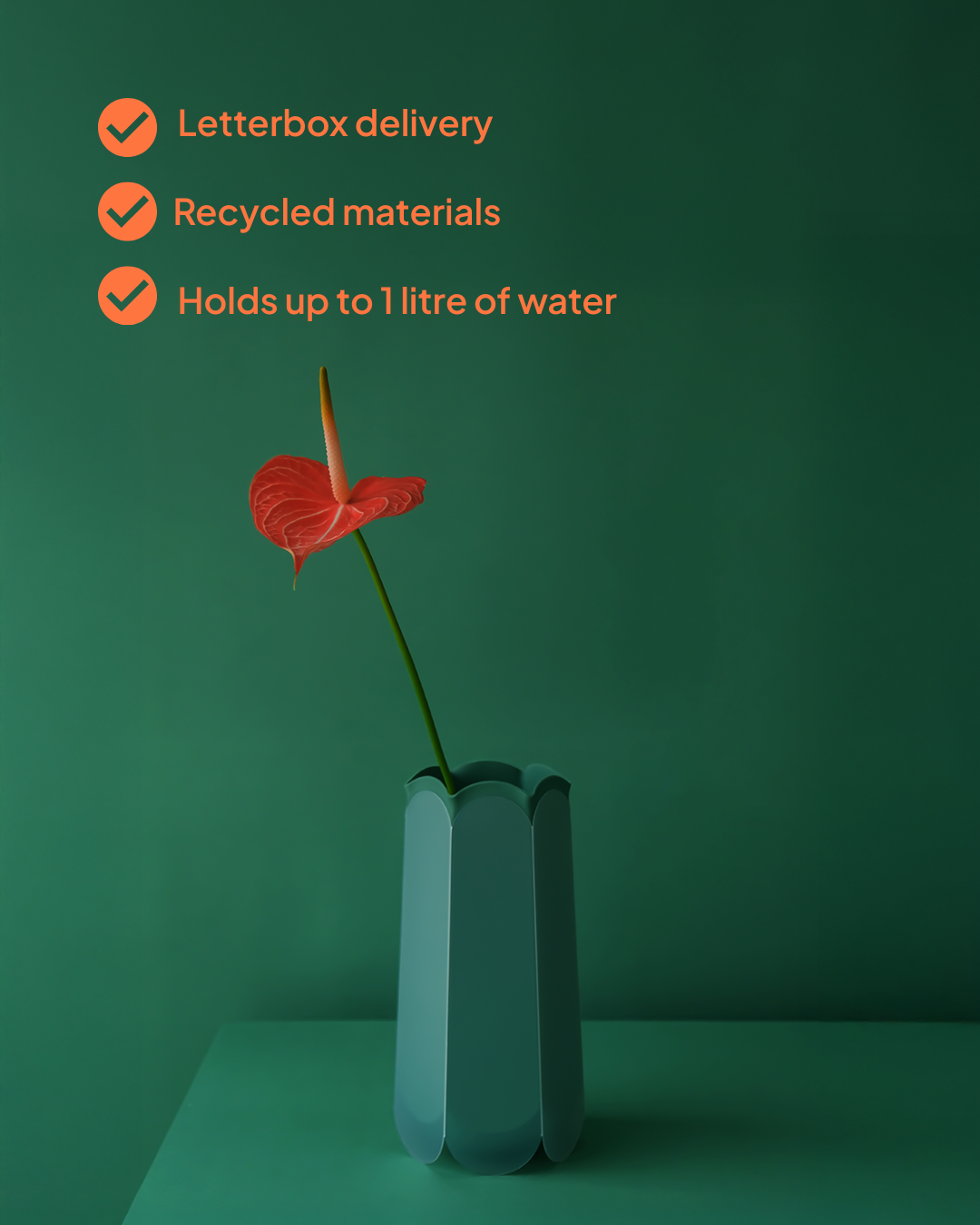 POTR Letterbox Vase in Pine green with a single red anthurium, with text highlighting letterbox delivery, recycled materials, and one-litre water capacity.